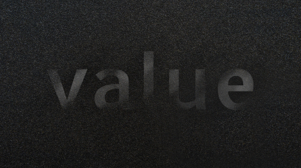 Animation of Dark Concrete with the Word Value with a Radial Shine